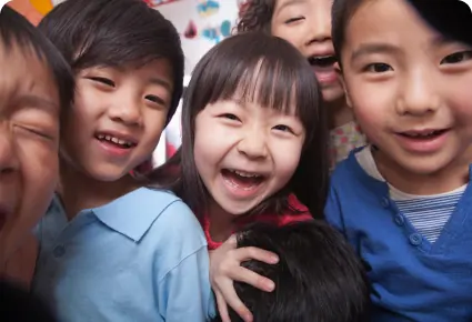 Smiling schoolchildren looking at the camera